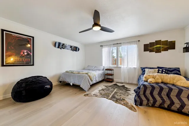 a bedroom with a bed and a couch