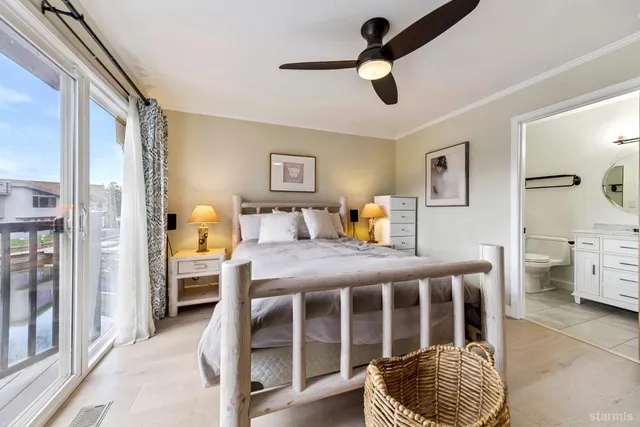 a balcony with table and chairs