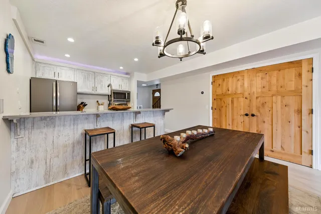 a view of kitchen and dining area with furniture