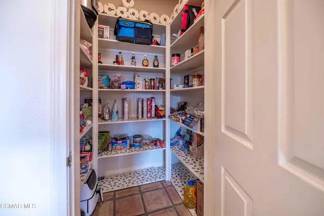 a bed room with a bed and wooden floor
