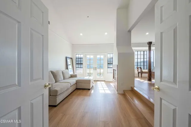 a view of a chair and table on the roof deck