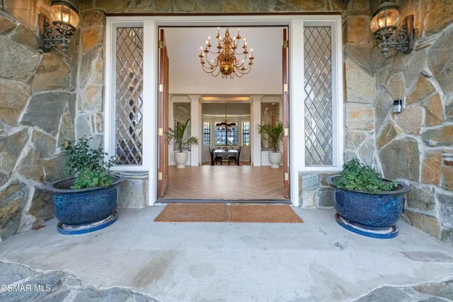 a bedroom with furniture and a potted plant