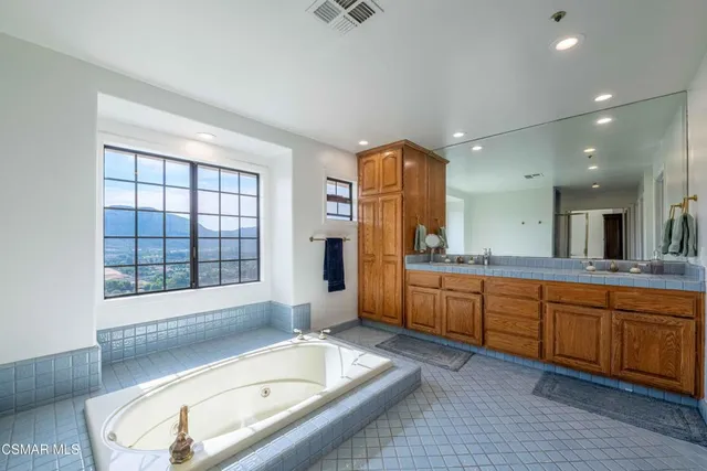 a view of a patio with a table chairs and a backyard
