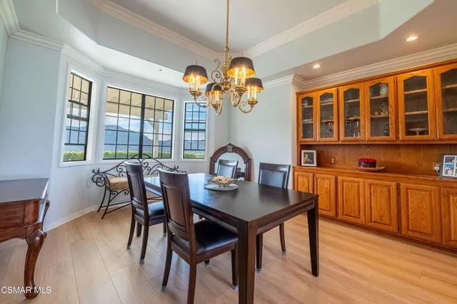 a kitchen with kitchen island granite countertop wooden cabinets and a stove