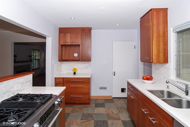 517 Berkeley Road Riverside, IL 60546 - Photo 4 of 15 a kitchen with a stove and a sink