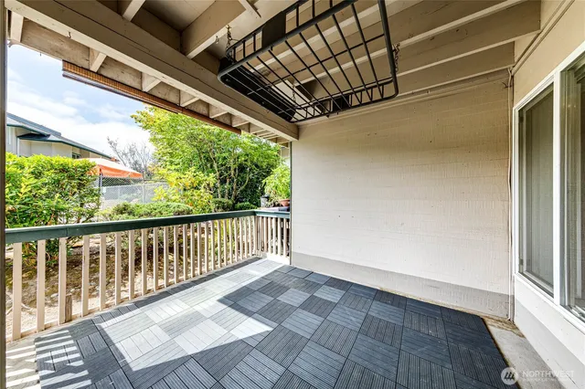 a kitchen with granite countertop a sink a stove and cabinets