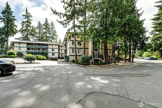 a view of a house with a small yard and wooden floor and fence and a window