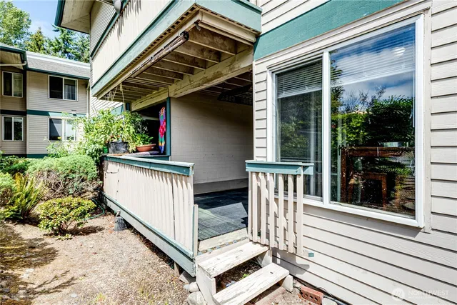 a view of balcony with wooden floor