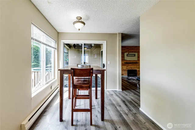a dining room with furniture and window