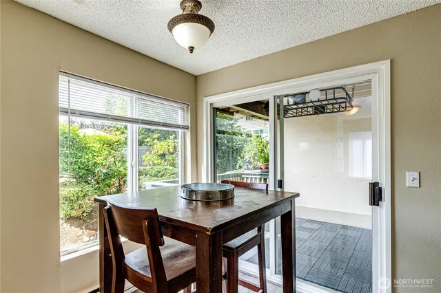 a view of a dining room with furniture window and outside view
