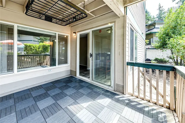 a view of entryway with a floor to ceiling window and wooden floor