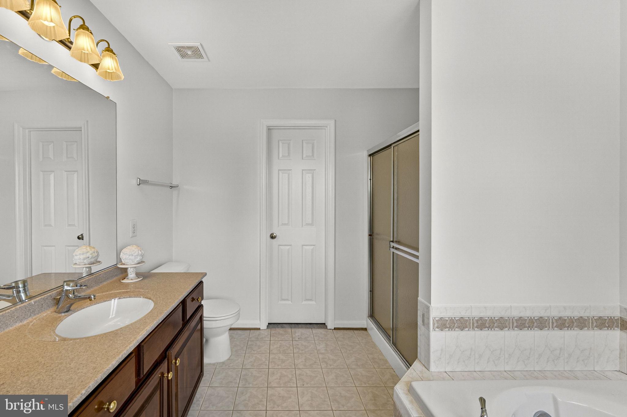 35130 Paxson Road Round Hill, VA 20141 - Photo 23 of 56 Cherry vanity and a large walk-in closet