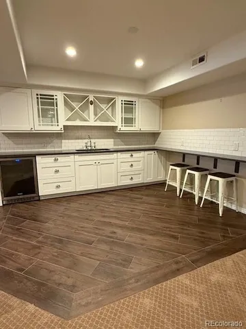 a view of kitchen with wooden floor