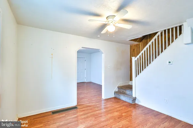a view of an entryway with wooden floor