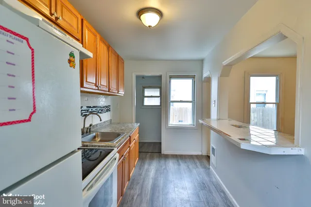 a kitchen with stainless steel appliances granite countertop a stove and a sink