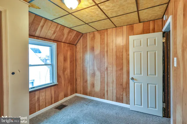 a view of a room with window and gate