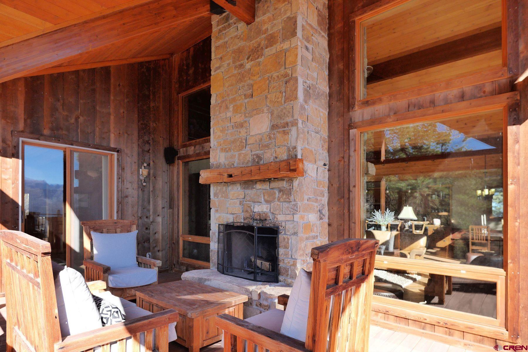 178 Valley View Road Ridgway, CO 81432 - Photo 12 of 45 a outdoor living space with patio furniture and a fireplace