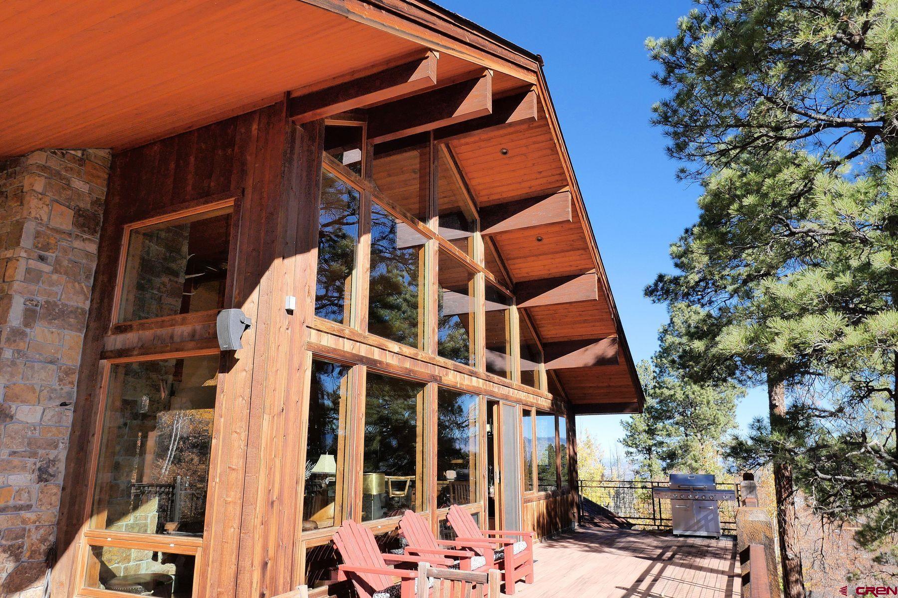 178 Valley View Road Ridgway, CO 81432 - Photo 15 of 45 a view of a tall building with large windows