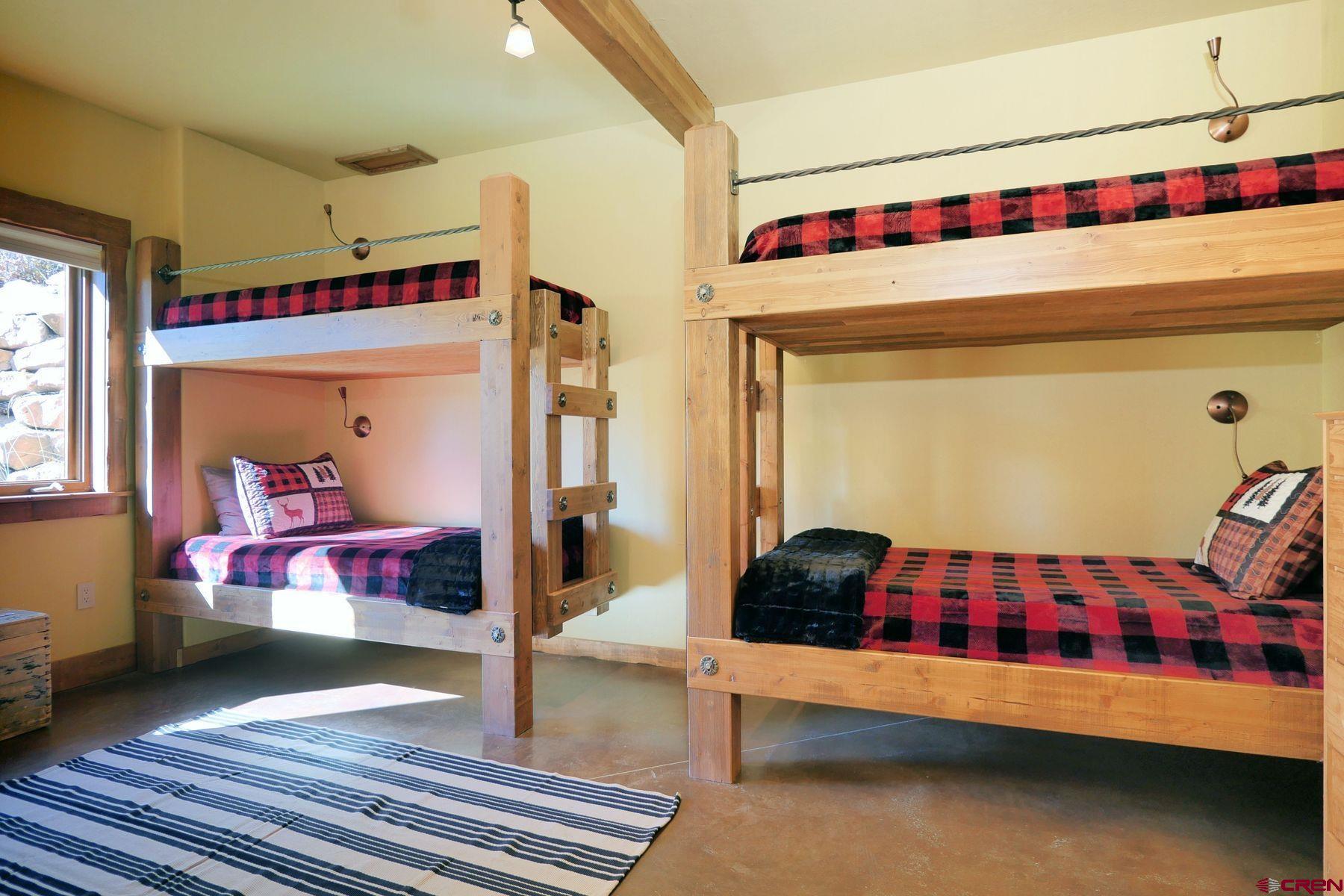 178 Valley View Road Ridgway, CO 81432 - Photo 27 of 45 a bedroom with furniture and a window