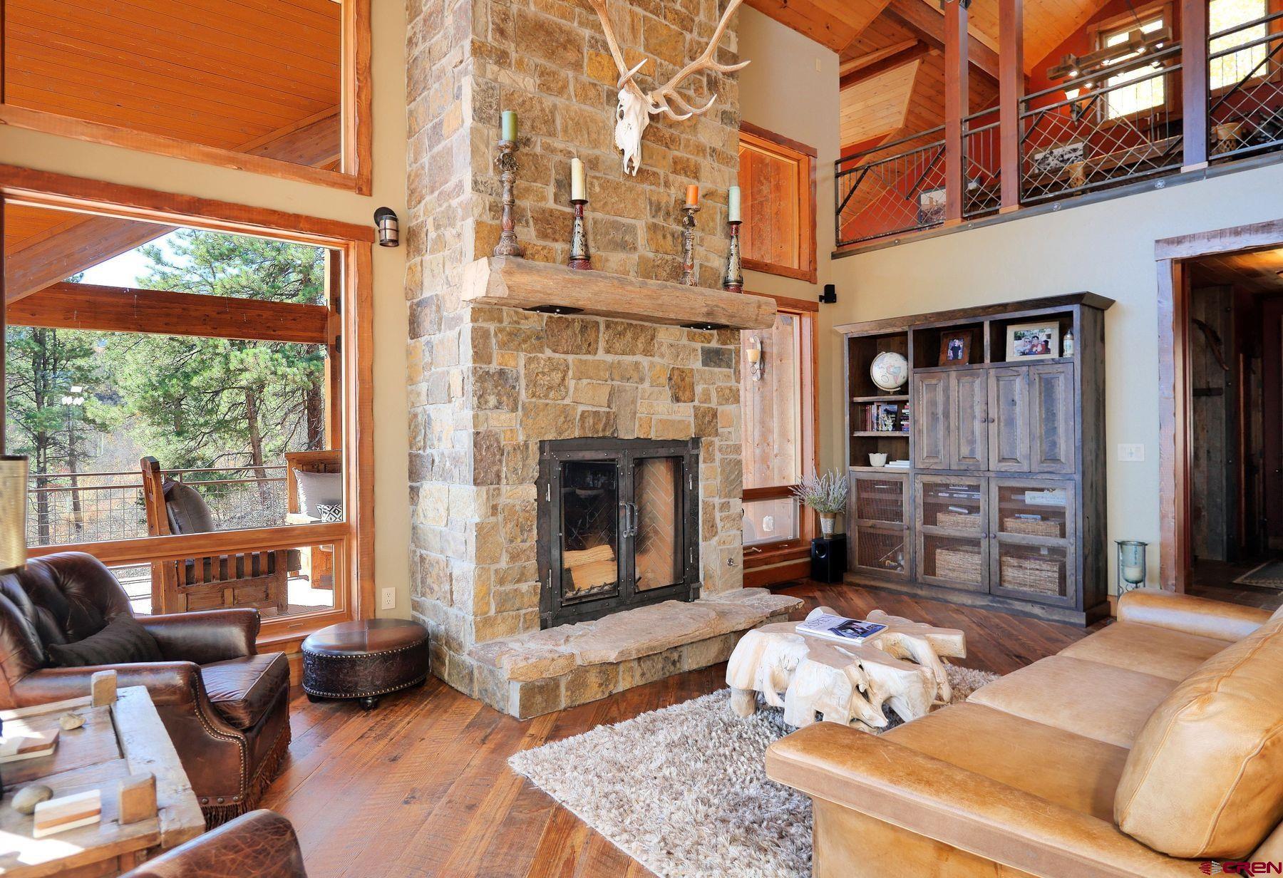 178 Valley View Road Ridgway, CO 81432 - Photo 4 of 45 a living room with furniture and a fireplace