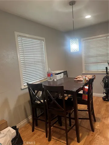 a view of a dining room and livingroom with furniture