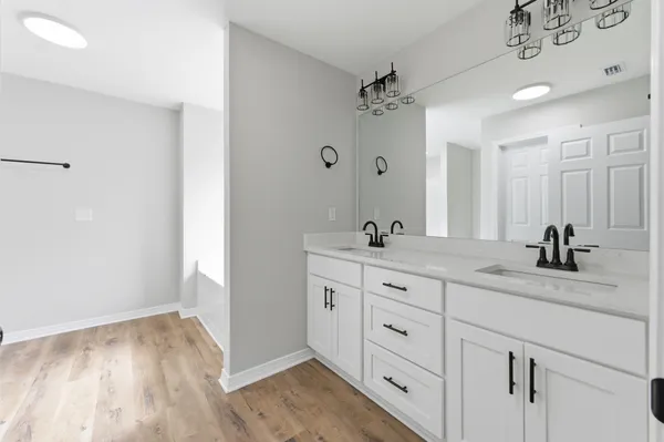 a bathroom with a bathtub and a window