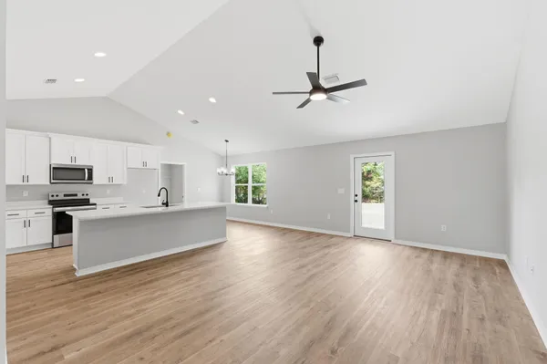 a view of room with hardwood floor and window