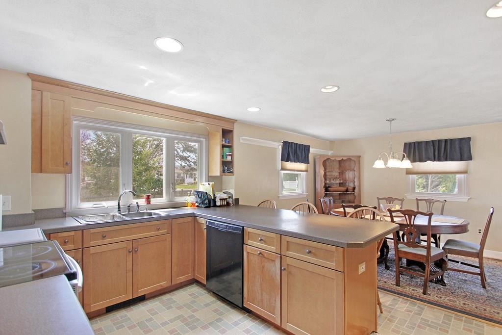 3 Jade Street Methuen, MA 01844 - Photo 14 of 35 a kitchen with sink a window and chairs