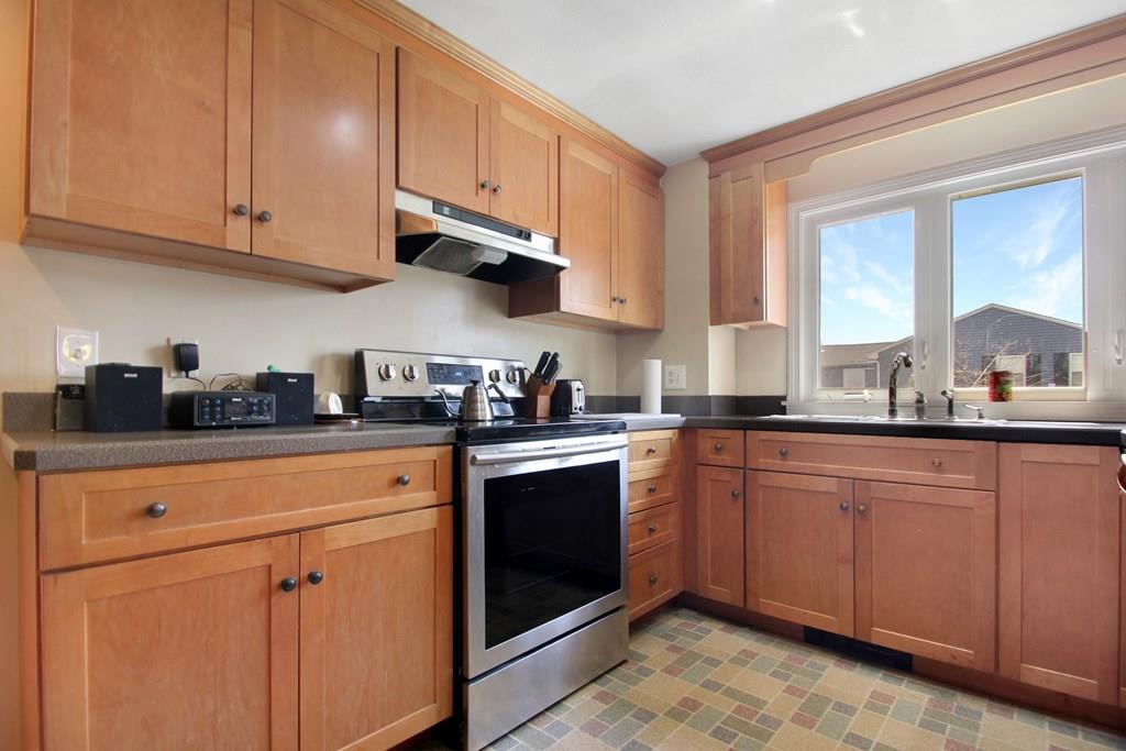 3 Jade Street Methuen, MA 01844 - Photo 15 of 35 a kitchen with stainless steel appliances granite countertop a sink and cabinets