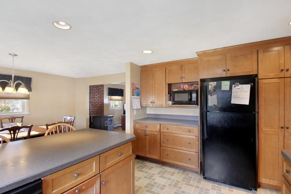 3 Jade Street Methuen, MA 01844 - Photo 16 of 35 a kitchen with kitchen island a counter top space a sink stainless steel appliances and cabinets