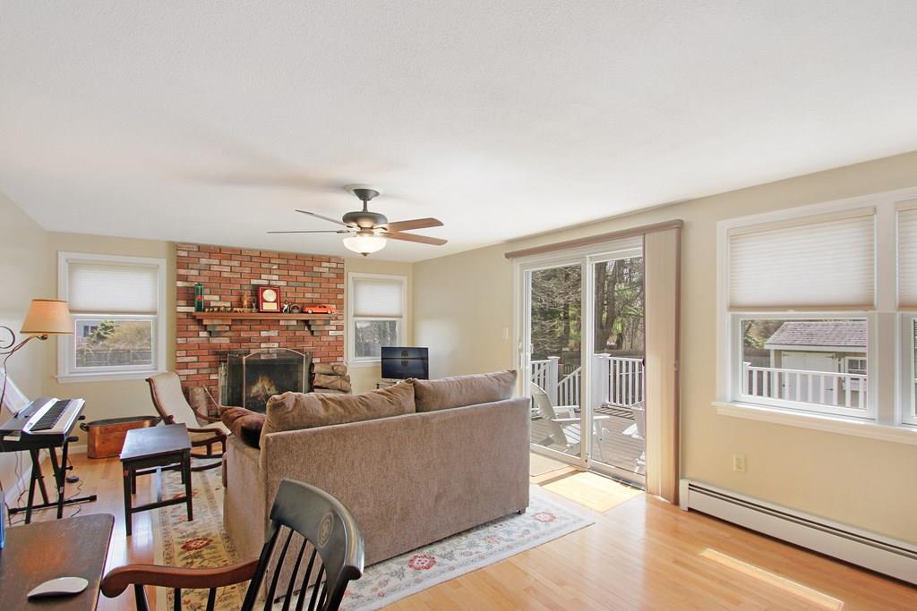 3 Jade Street Methuen, MA 01844 - Photo 19 of 35 a living room with furniture a chandelier and a large window
