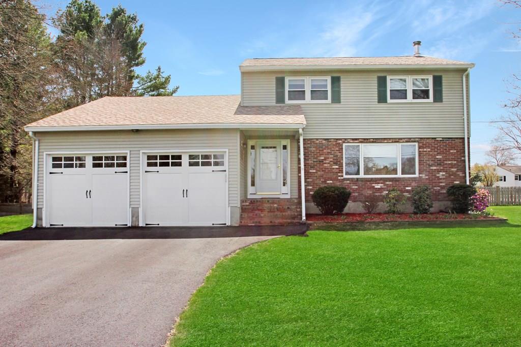 3 Jade Street Methuen, MA 01844 - Photo 2 of 35 a front view of a house with a yard and garage