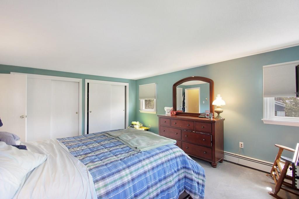 3 Jade Street Methuen, MA 01844 - Photo 23 of 35 a bedroom with a bed and dresser with mirror