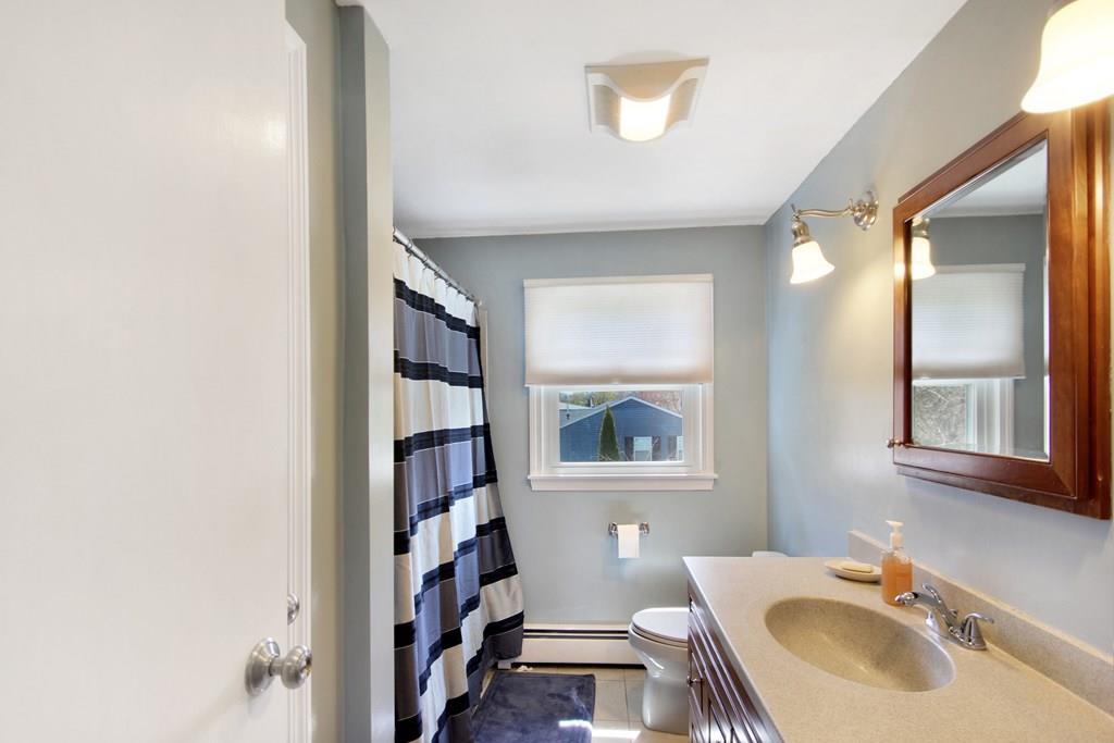 3 Jade Street Methuen, MA 01844 - Photo 28 of 35 a bathroom with a sink a toilet and a mirror