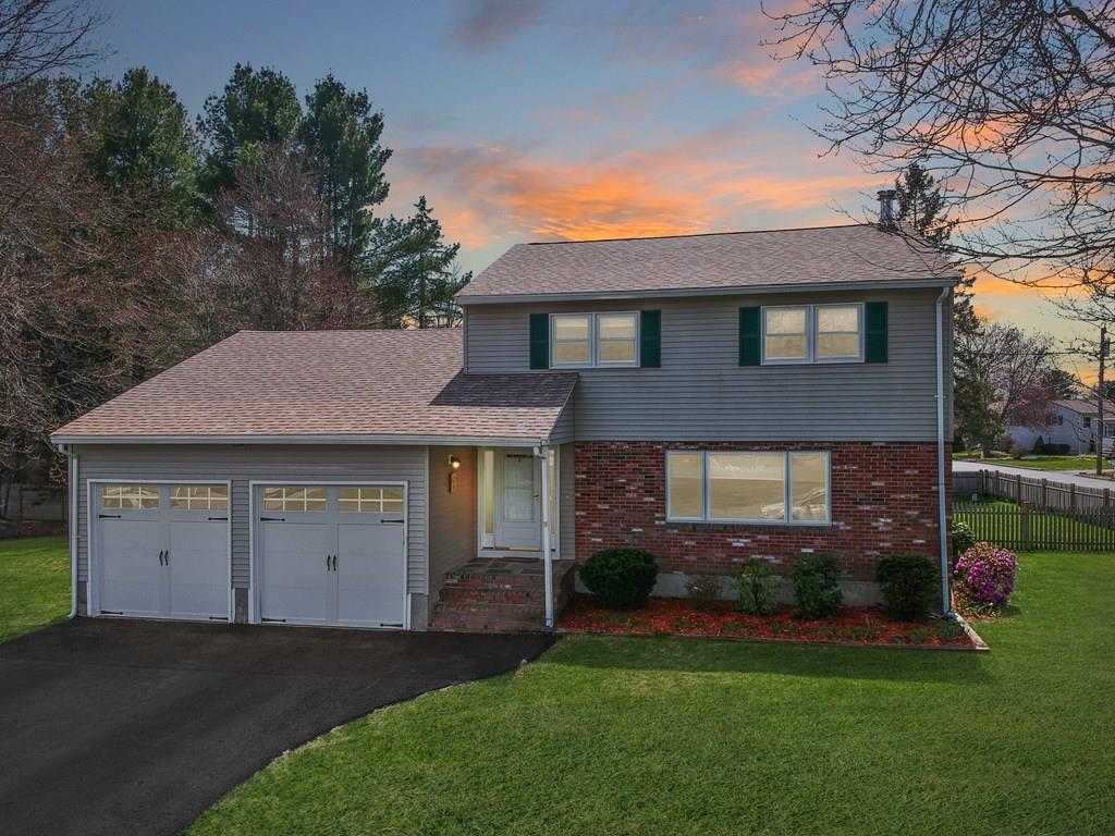 3 Jade Street Methuen, MA 01844 - Photo 35 of 35 a front view of a house with a yard and garage