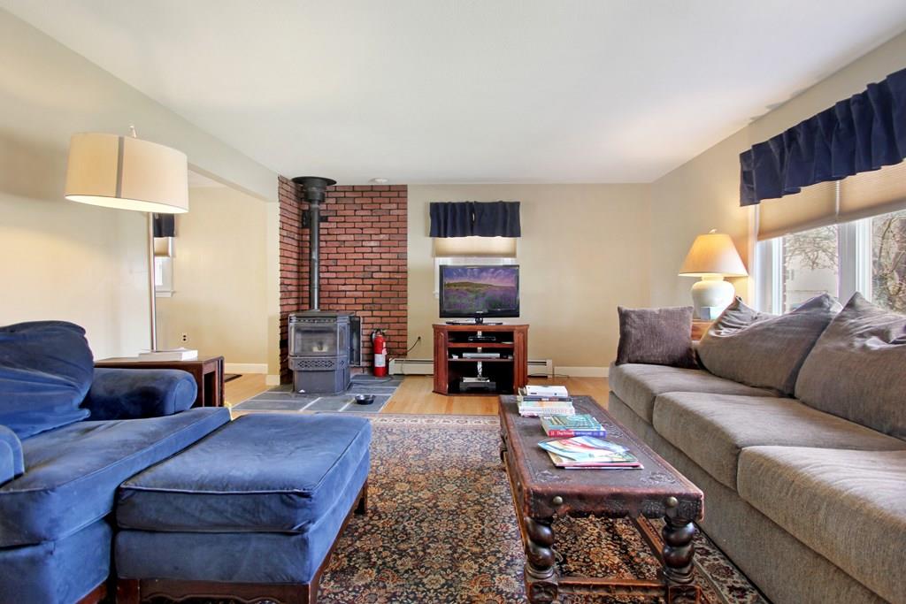 3 Jade Street Methuen, MA 01844 - Photo 8 of 35 a living room with furniture and a fireplace