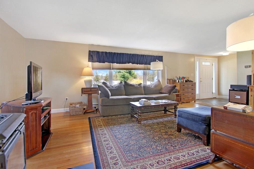 3 Jade Street Methuen, MA 01844 - Photo 9 of 35 a living room with furniture and a flat screen tv