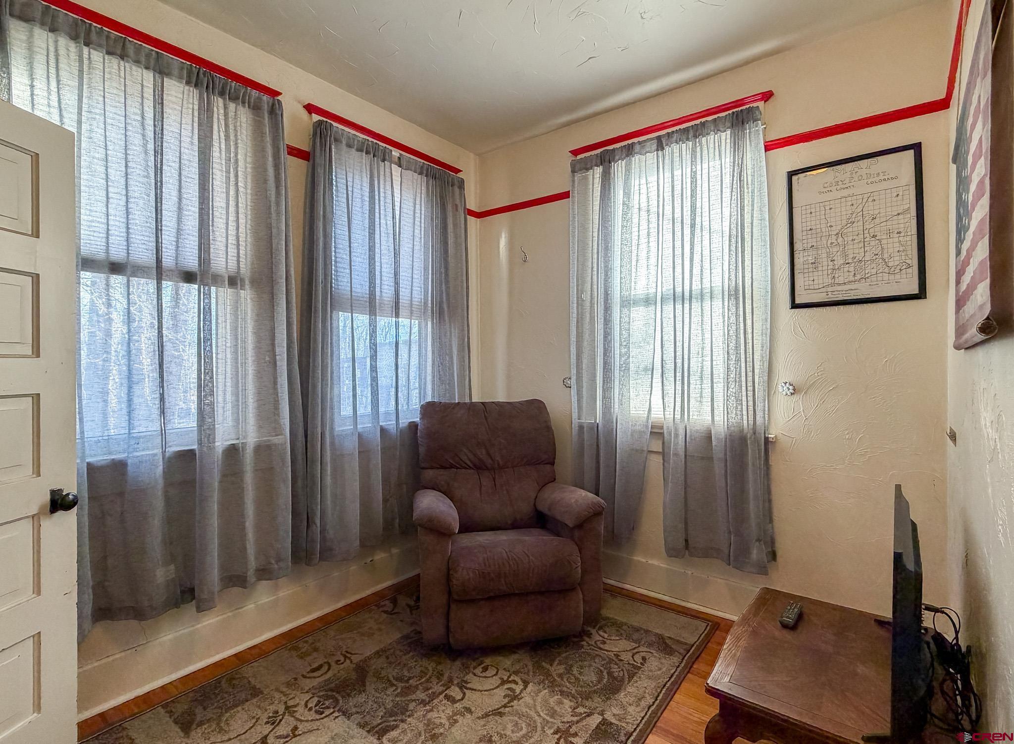 8903 Marshalls Road Austin, CO 81410 - Photo 13 of 45 a living room with furniture and a window