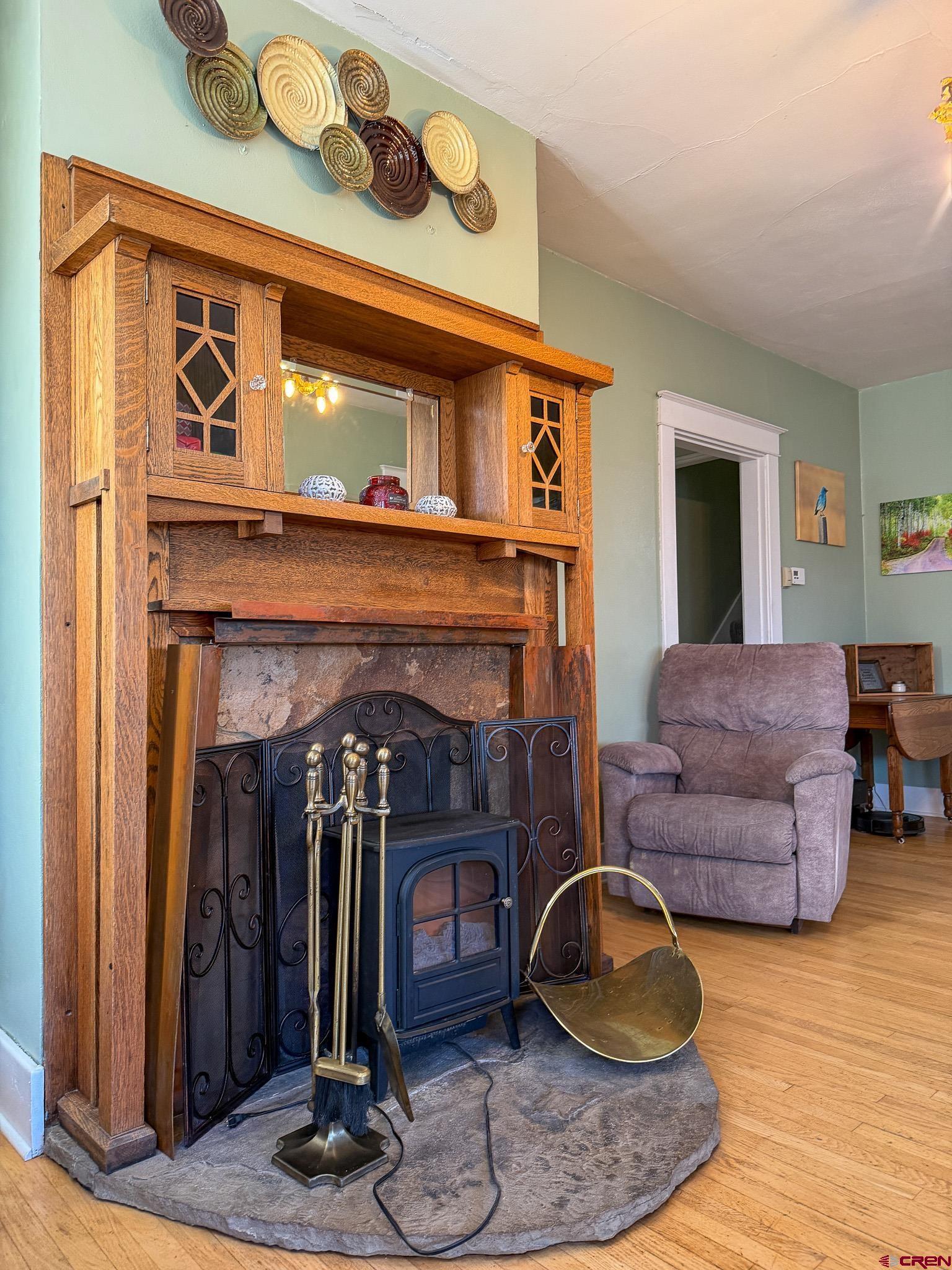 8903 Marshalls Road Austin, CO 81410 - Photo 17 of 45 a living room with furniture and a fireplace