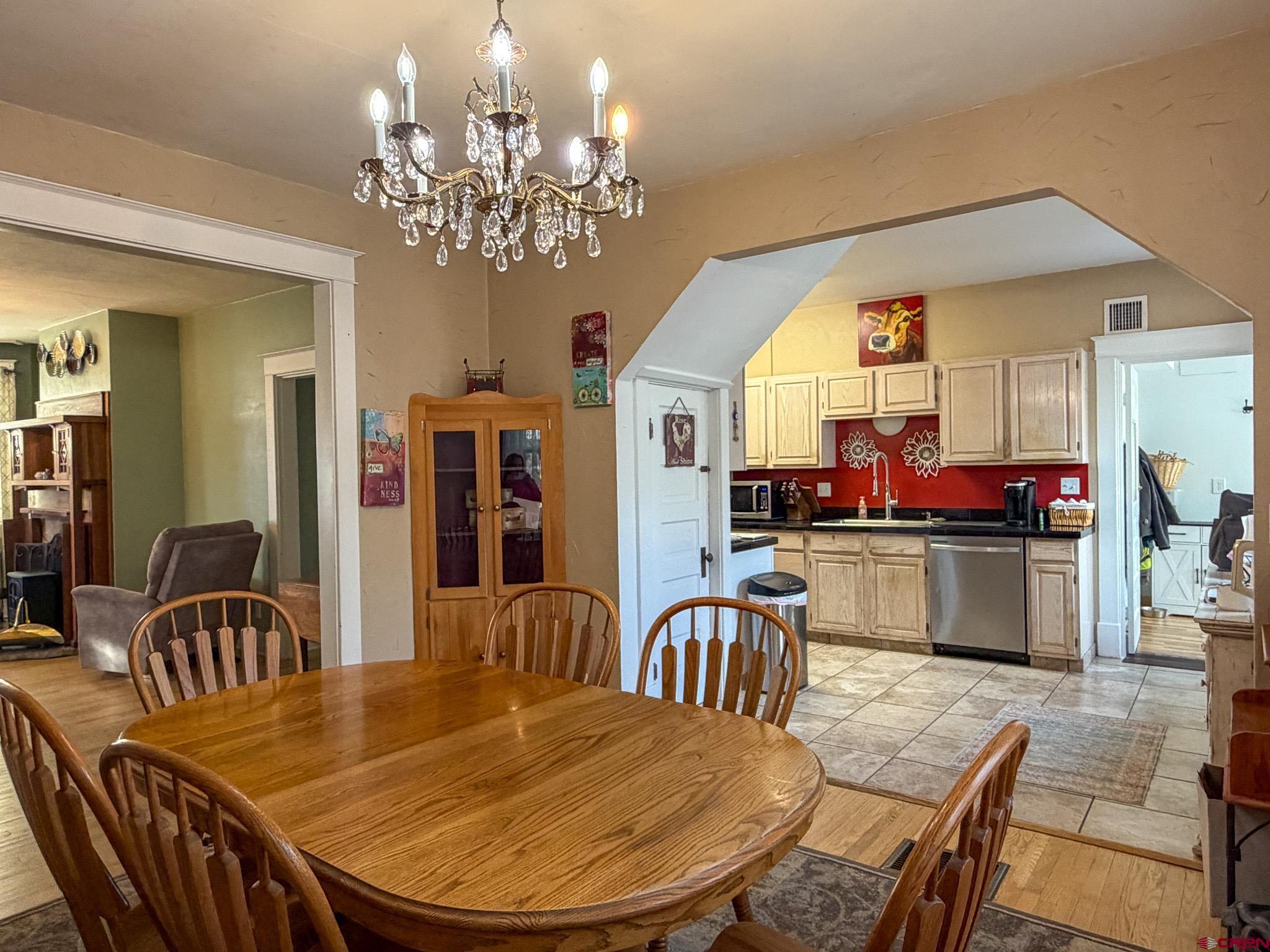 8903 Marshalls Road Austin, CO 81410 - Photo 18 of 45 a view of a dining room with furniture and chandelier