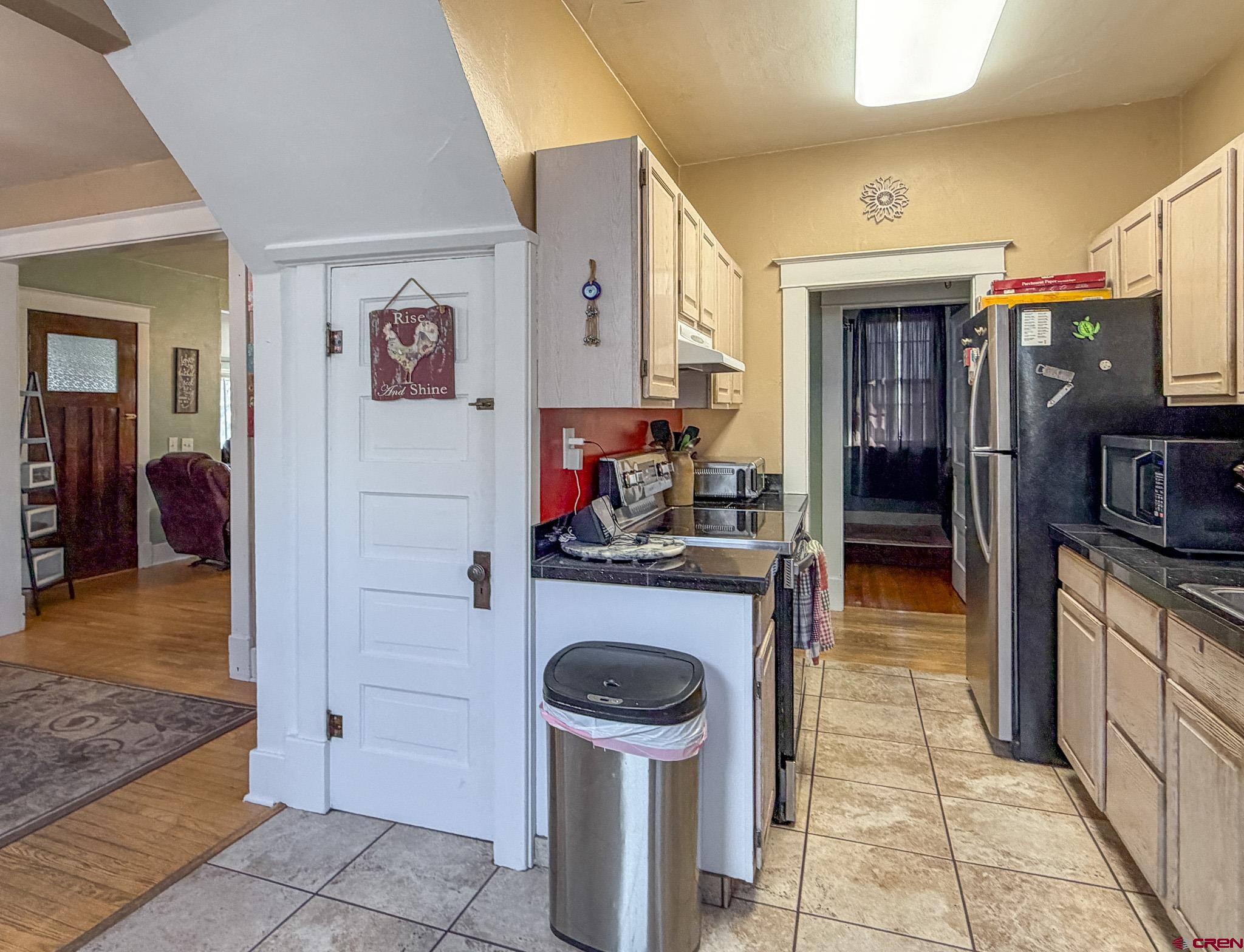 8903 Marshalls Road Austin, CO 81410 - Photo 21 of 45 a kitchen with stainless steel appliances granite countertop a refrigerator and a stove