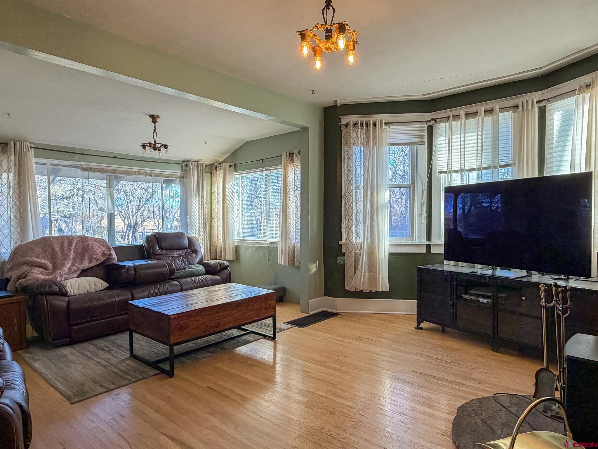 8903 Marshalls Road Austin, CO 81410 - Photo 42 of 45 a living room with furniture and a flat screen tv