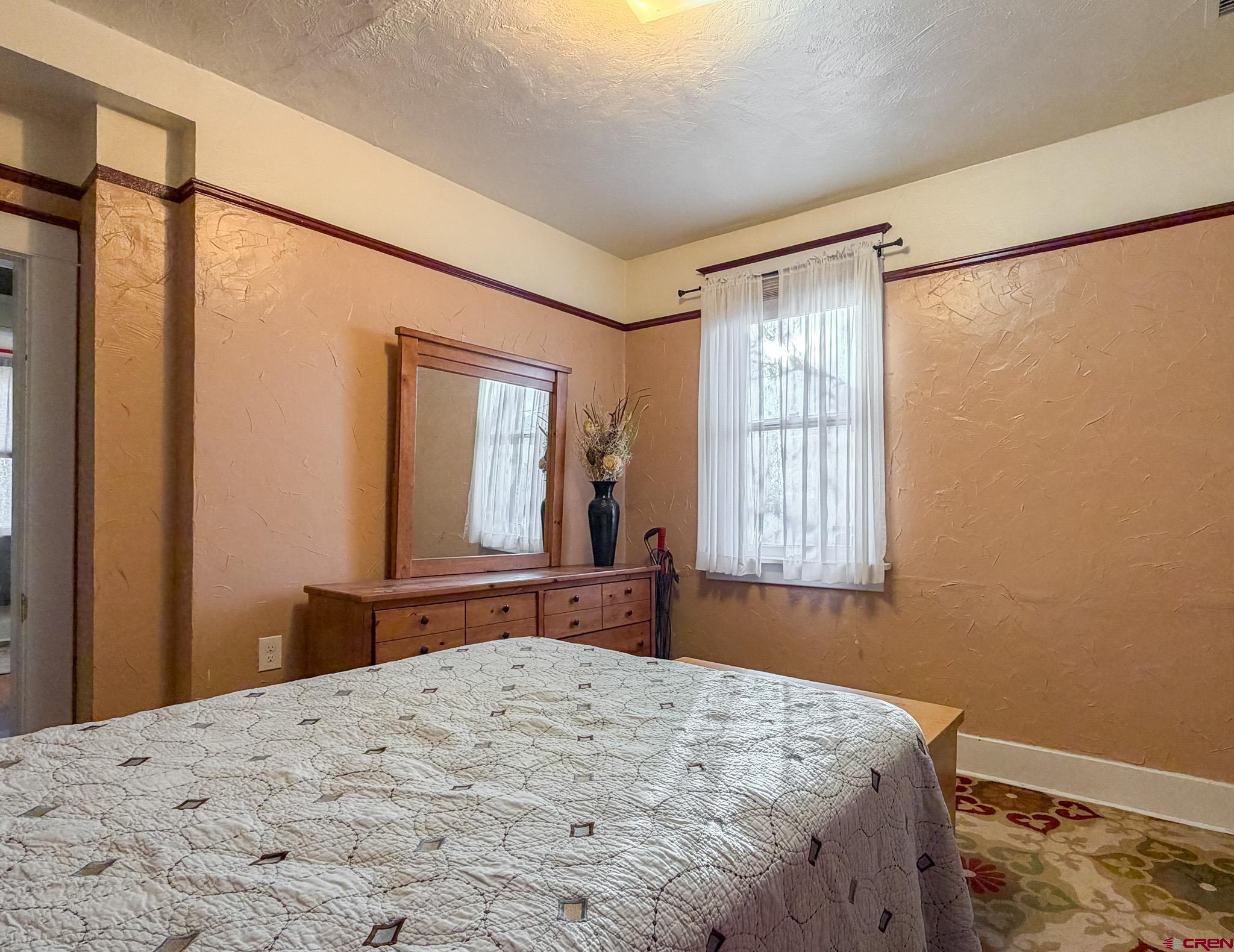 8903 Marshalls Road Austin, CO 81410 - Photo 6 of 45 a bedroom with a bed and a window