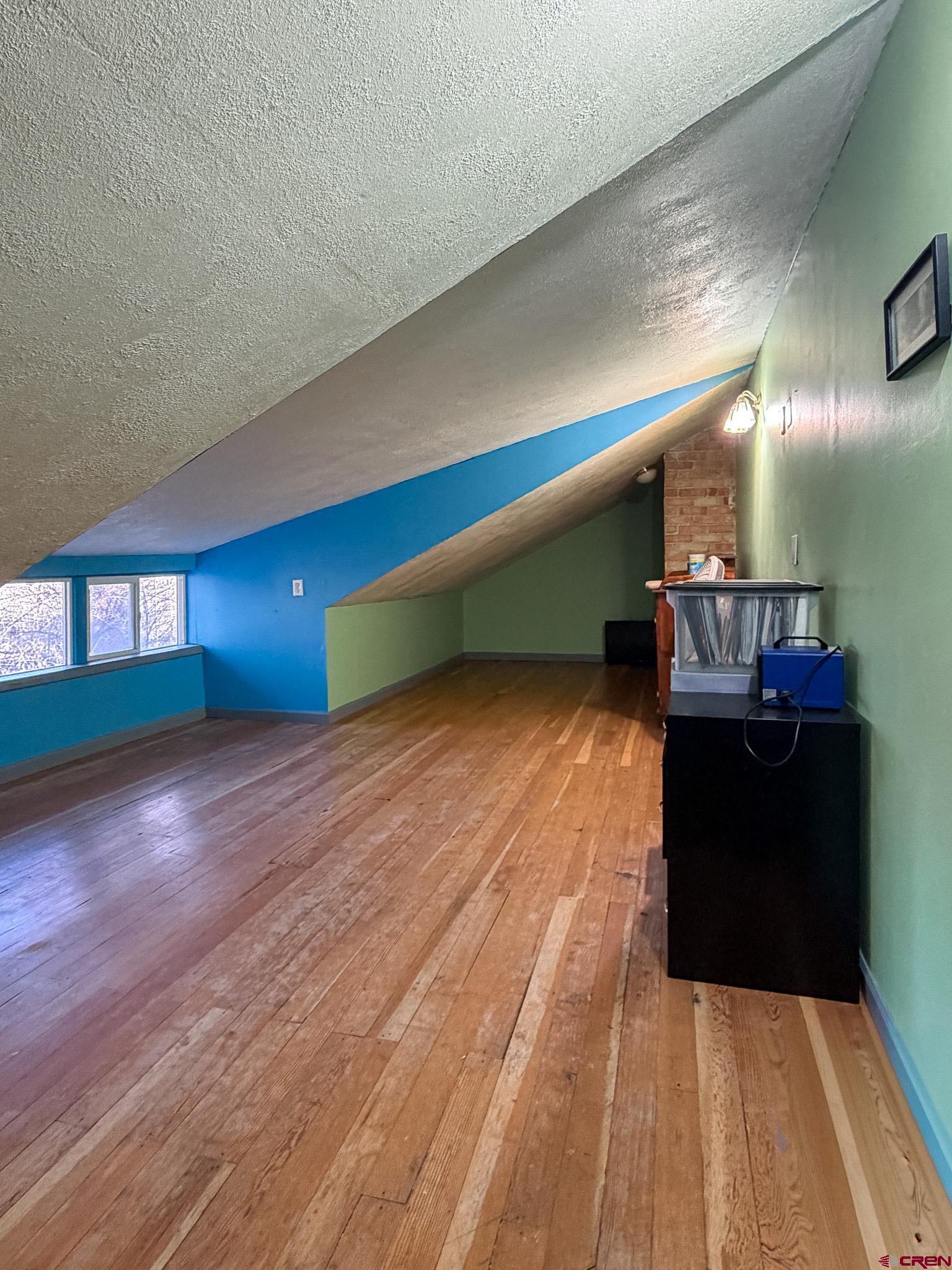 8903 Marshalls Road Austin, CO 81410 - Photo 9 of 45 a living room with hard wood floors and a wooden floor
