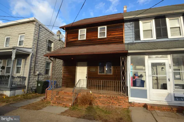 a front view of a house with a garage