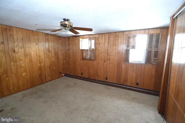 a view of an empty room and a window