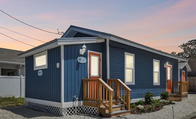 a front view of a house with garage
