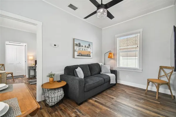a living room with furniture and a window