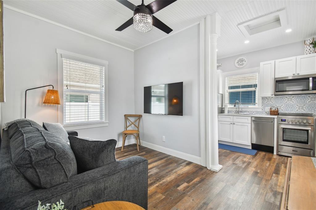 602 Skinner Boulevard Dunedin, FL 34698 - Photo 13 of 27 a living room with furniture and a window