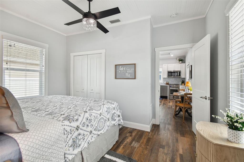 602 Skinner Boulevard Dunedin, FL 34698 - Photo 16 of 27 a bedroom with a bed and a wooden floor